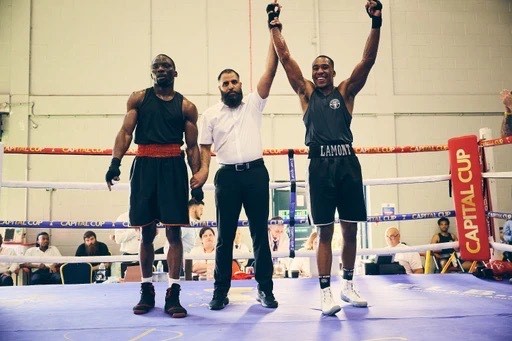 Marcus Lamont celebrating victory in the ring